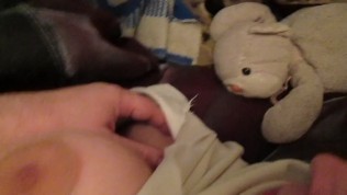 Touching her big tits in a bed